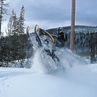 Photo of a person snowmobiling