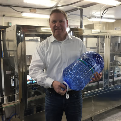 Murray Floyd displays a newly produced bottle from the company's new manufacturing facility in Cranbrook.