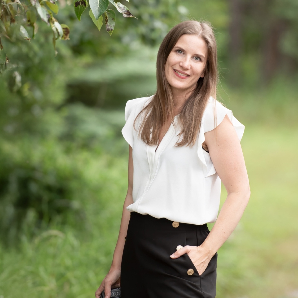 Denise Hoffgaard standing holding her camera