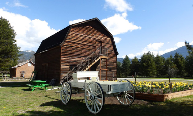 Doukhobor Barn and white carriage in foreground. 