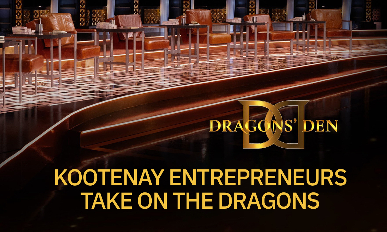 Dragons' Den stage with logo. 