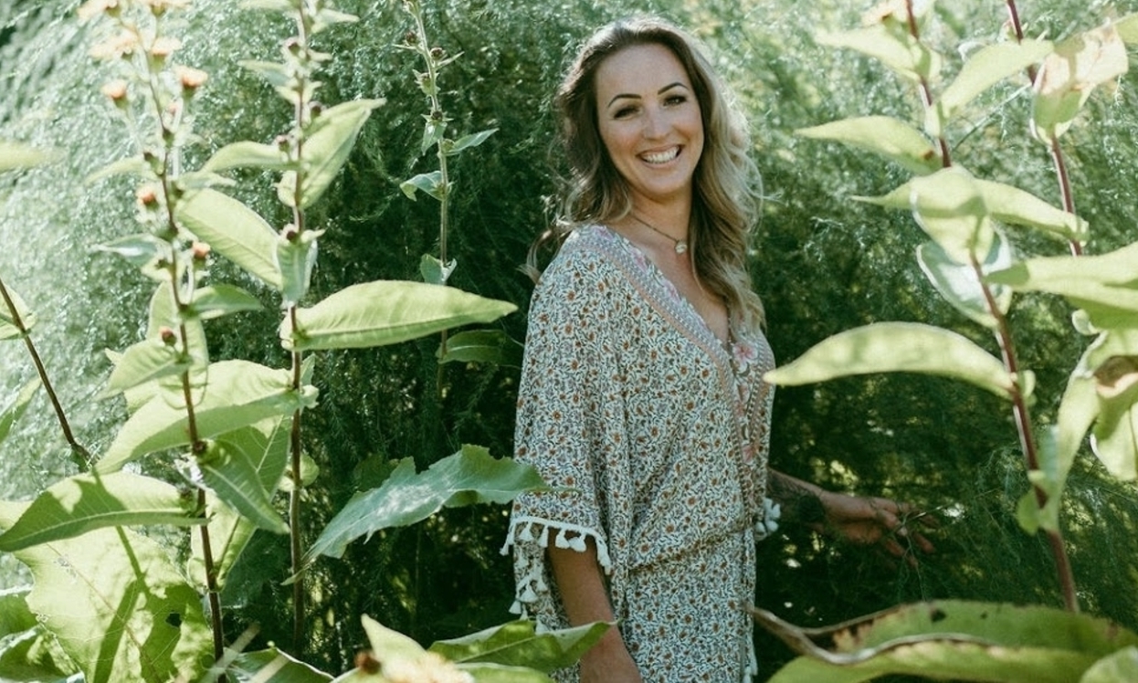 Owner of Love and Lemons standing in a garden