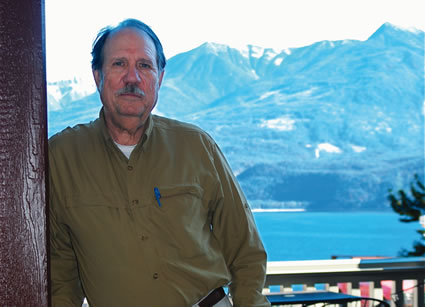 Photo of John Eckland on a balcony