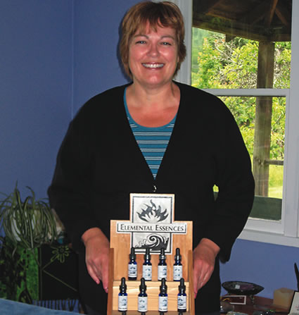 Marion Mazzocchi holding a rack of remedies