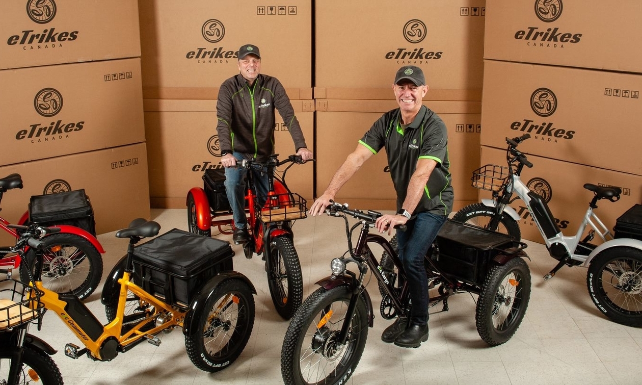 Grant Sharam and Jim Cunnington sitting on eTrikes