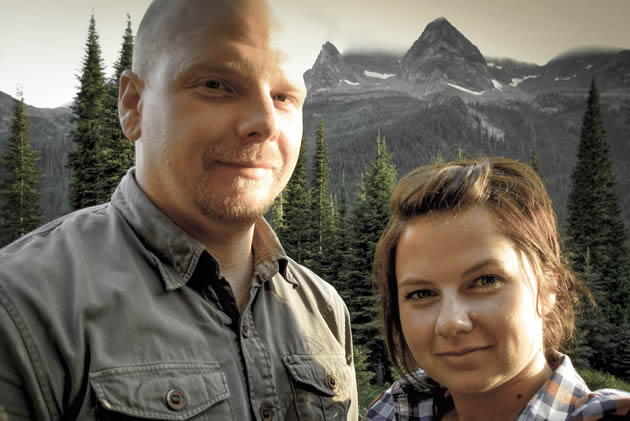 Faceshots of a man and  women with the mountains in the background. 