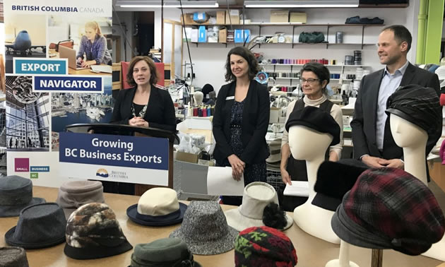 Michelle Mungall, MLA for Nelson-Creston, announces the extension of the Export Navigator Pilot Project. Also pictured, Andrea Wilkey, Executive Director, Community Futures Central Kootenay, Liz Cohoe, owner, Lillie and Cohoe, and Michael Hoher, Export Navigator advisor.