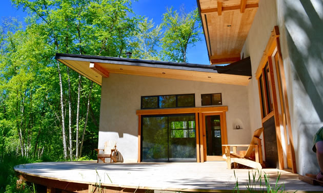 The retreat centre has a large circular deck with trees close by.