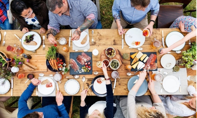 Close-up of people serving food
