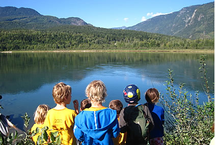 Photo of a group of kids at a lake
