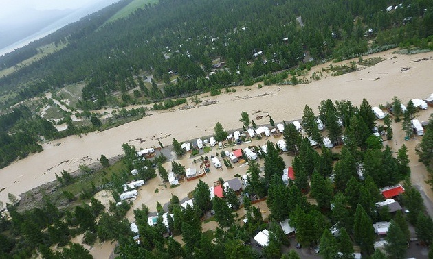 An aerial shot of the flooding at Elk River near Fernie.  The photo shows a number of houses that were surrounded by water and others threatened.