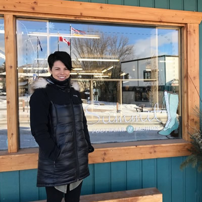 Jocelyn Brunner stands in front of her Invermere store, Summit Footwear & Fashion.