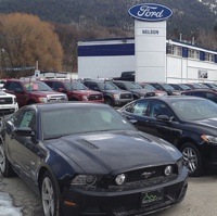 A photo of the Nelson Ford Sales car lot. 