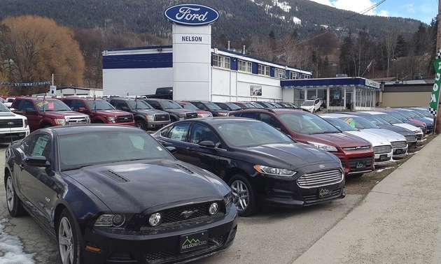 A photo of the Nelson Ford Sales car lot. 