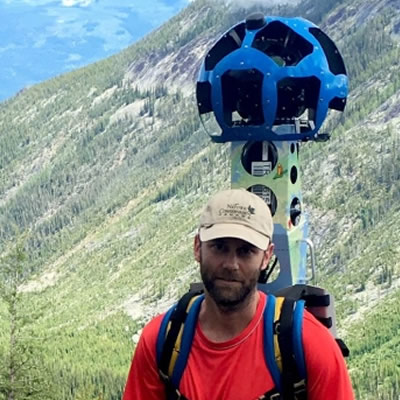 Picture of hiker with Google Trekker camera. 