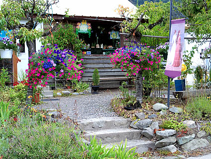 Garden Graces, front of building with flowersaroundthe entrance