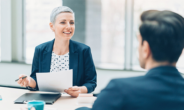 Woman conducting interview with potential employee. 