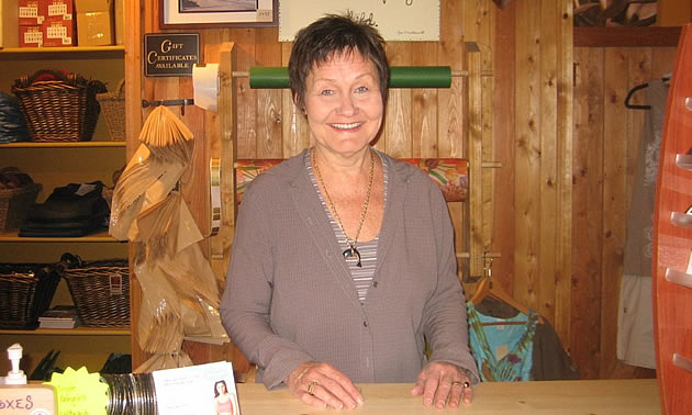 lady standing behind a counter in a store