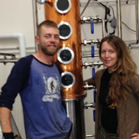 Kevin and Lora Goodwin with the still at Kootenay Country Craft Distillery.