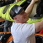 Owner Rob Porter hanging up some kayaks at Just Liquid Sports in Cranbrook