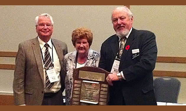 Ken Fisher (right), first vice-chair of Kootenay Rockies Tourism, is seen here making a presentation to Norm and Joyce Mackie of Ainsworth Hot Springs several years ago