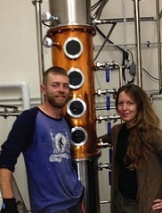 Kevin and Lora Goodwin with the still at Kootenay Country Craft Distillery.