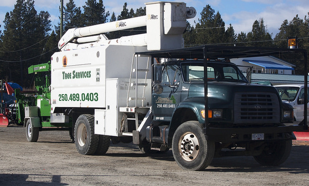 Kootenay Landscape’s new bucket truck  with chipper on the back.