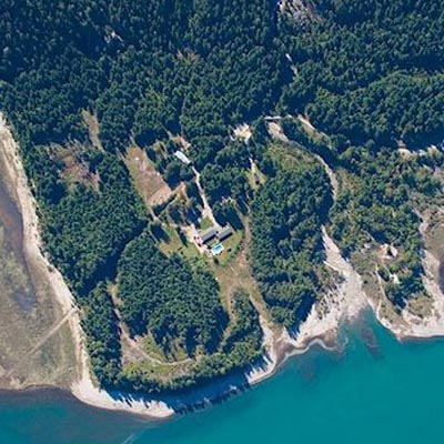 An aerial view of the Mulvehill Creek Eco-Retreat on the shore of the Upper Arrow Lakes