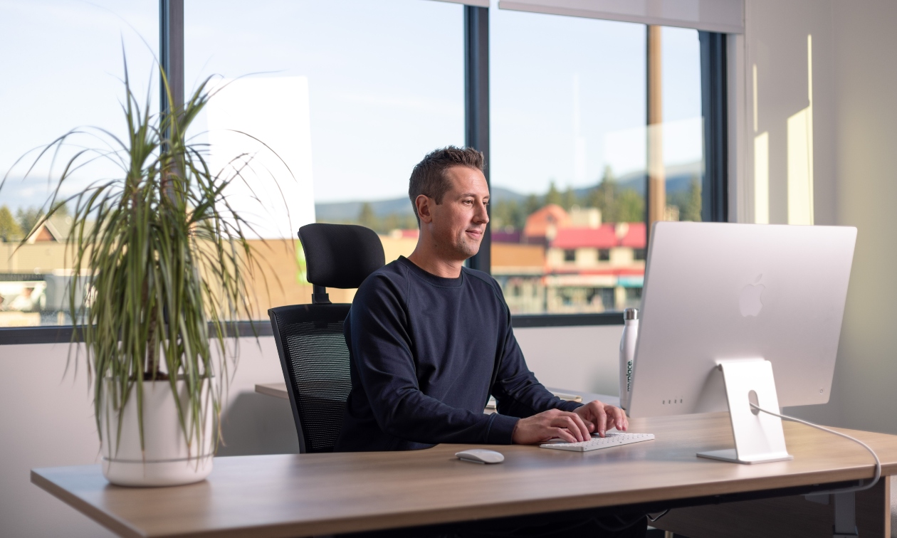 shot of Andrew Ladriere at his desk