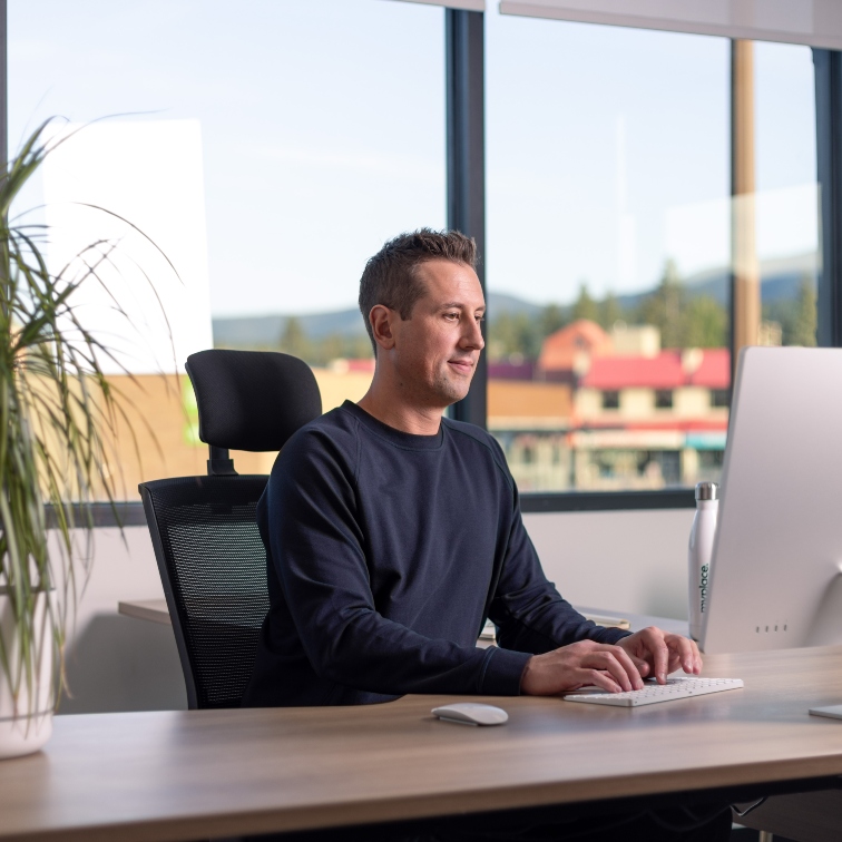 shot of Andrew Ladriere at his desk