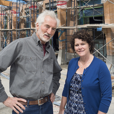 Russell Precious (left) and Deirdre Lang — co-project managers of the Nelson Commons development — stand in front of the nearly completed building that will serve as both a new store for the Kootenay Co-op and home to 54 condo owners. 
