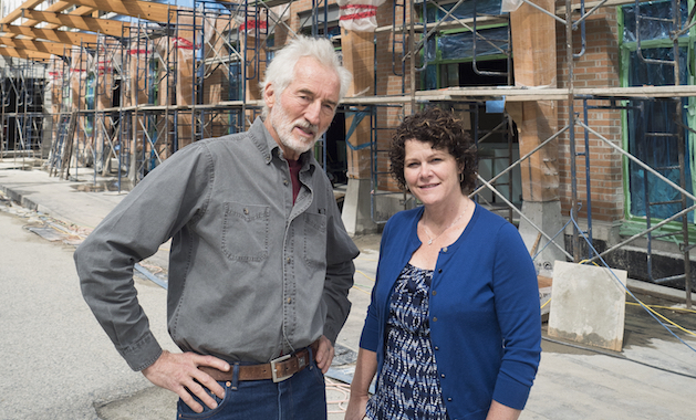 Russell Precious (left) and Deirdre Lang — co-project managers of the Nelson Commons development — stand in front of the nearly completed building that will serve as both a new store for the Kootenay Co-op and home to 54 condo owners. 