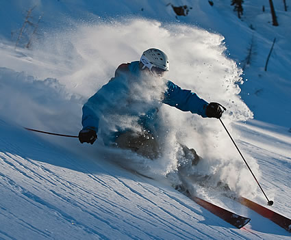 person skiing downhill