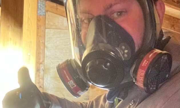 Nic's wife with a respirator on