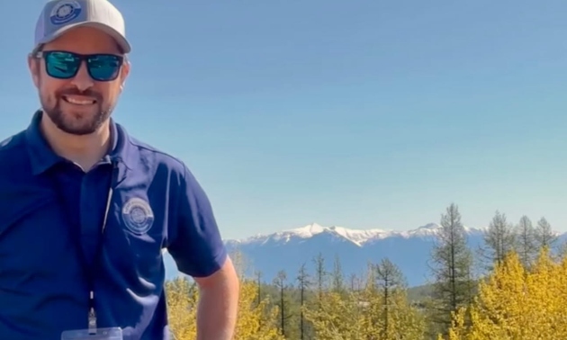 Nic in front of a mountain range