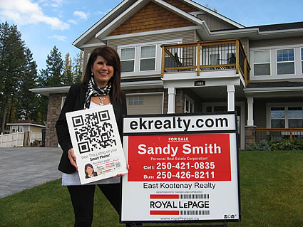 Photo of a Realtor and a home for sale