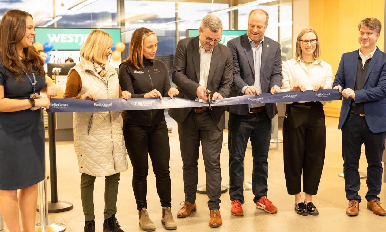 people at Cranbrook Airport lined up to sign documents