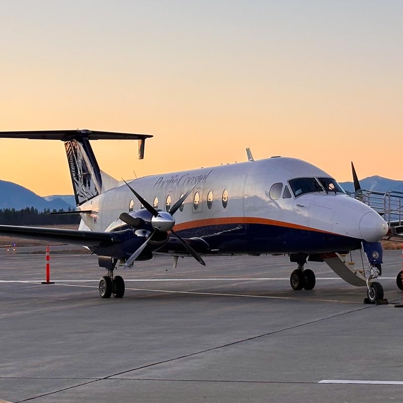 people at Cranbrook Airport lined up to sign documents