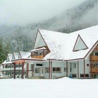 Peaks Lodge under snow in the winter.