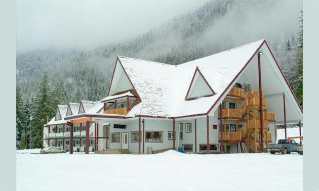 Peaks Lodge under snow in the winter.