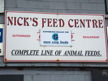 Nick's Feed Centre sign