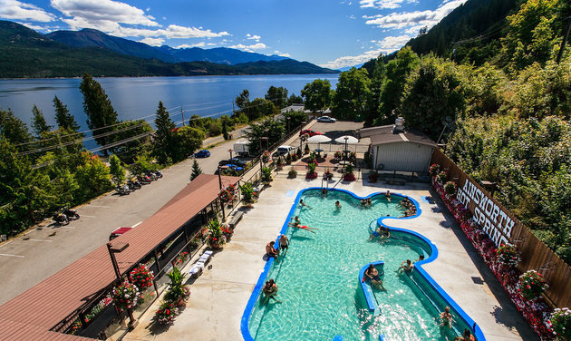 The photo shows the large hot pool at Ainsworth Hot Springs.