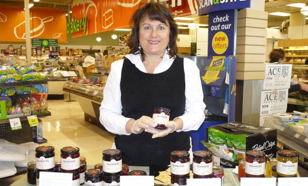 Faith Saunders offers customers at Save-On-Foods in Cranbrook a taste test of some of her jams and jellies.