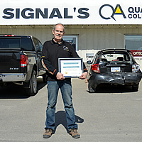D'Arcy Giberson standing in front of Signal Collision in Cranbrook. 