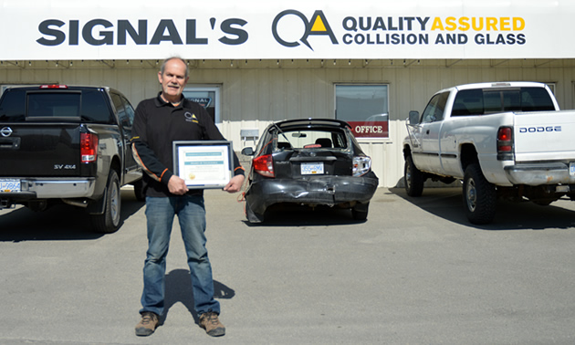 D'Arcy Giberson standing in front of Signal Collision in Cranbrook. 