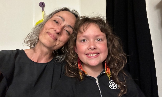 Skye-lea with her child indoors