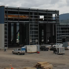 Photo of a large blue facility being built.