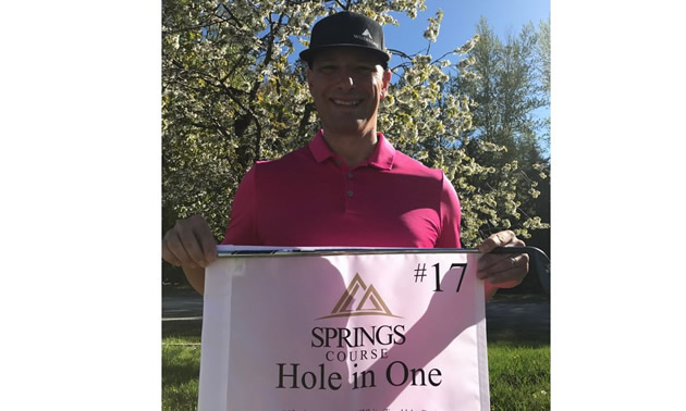 Golf pro Doug Schneider with proof of his hole-in-one shot at the Springs Golf Course in Radium Hot Springs. 