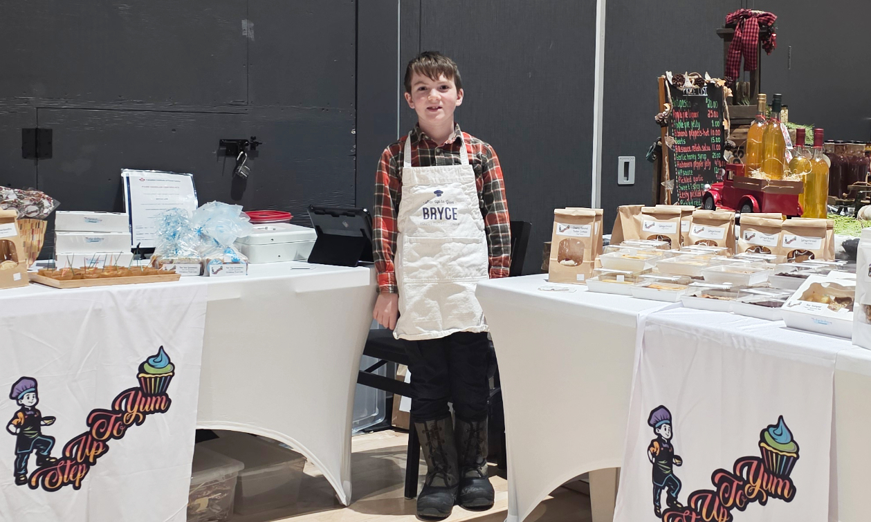 Bryce standing next to his creations