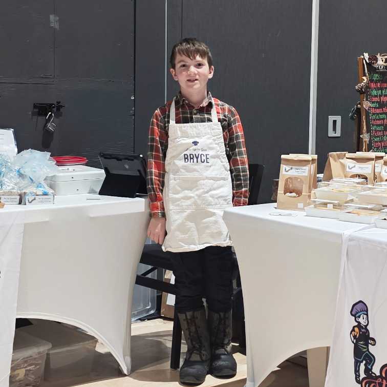 Bryce standing next to his creations